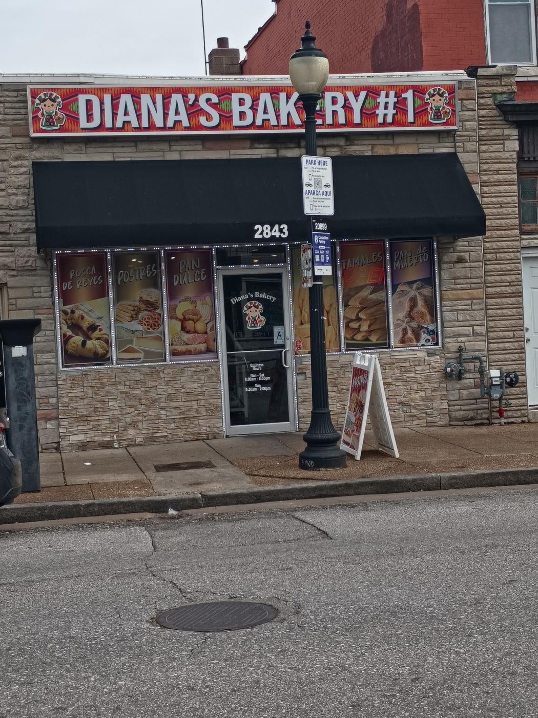 The Diana's Bakery storefront with a Diana's Bakery banner sign and window displays on Cherokee Street.