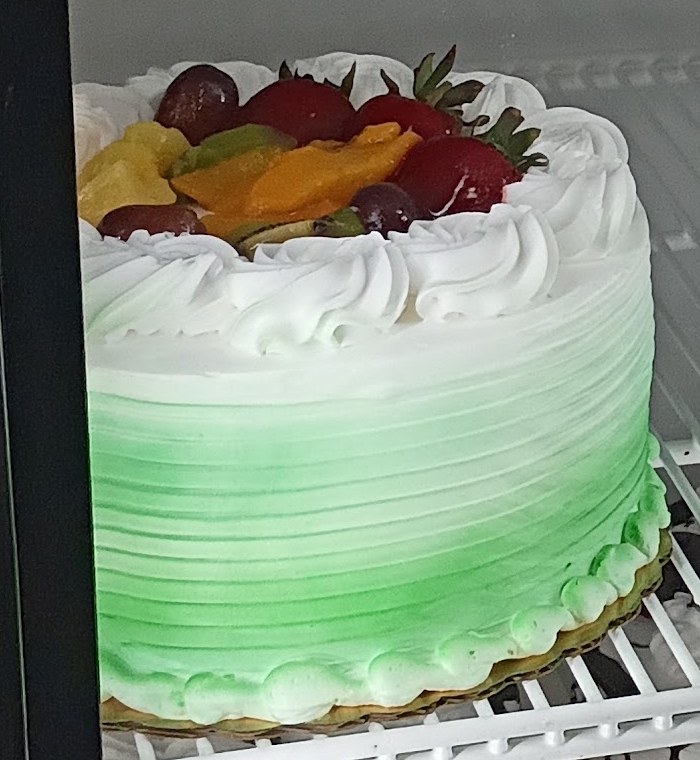 An 8 inch tres leches cake with fruit topping at Diana's Bakery.